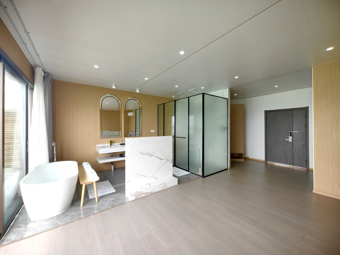 Contemporary bathroom suite at Sicily Hotel featuring freestanding tub