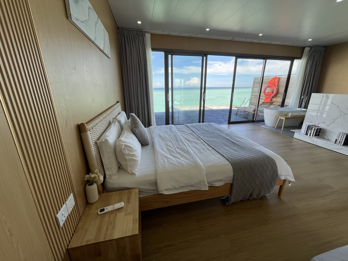 Modern bedroom at Sicily Resort on the Celebes Sea with ocean bathtub
