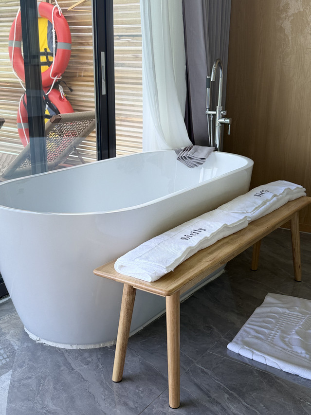 Sleek white freestanding bathtub at Sicily Resort