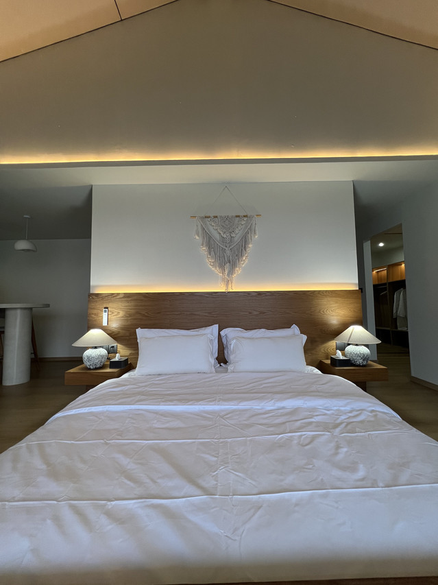 Inviting bed at Sicily Hotel near Bum Bum Island with macrame decor