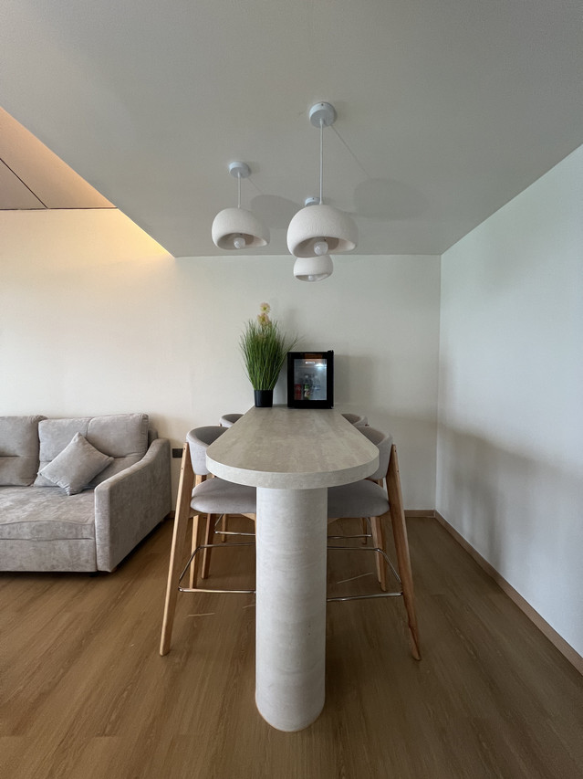 Living space featuring high breakfast bar with seating at Sicily Hotel