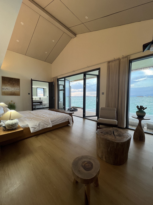 Spacious bedroom at Sicily Hotel in the Celebes Sea with large ocean-facing balcony