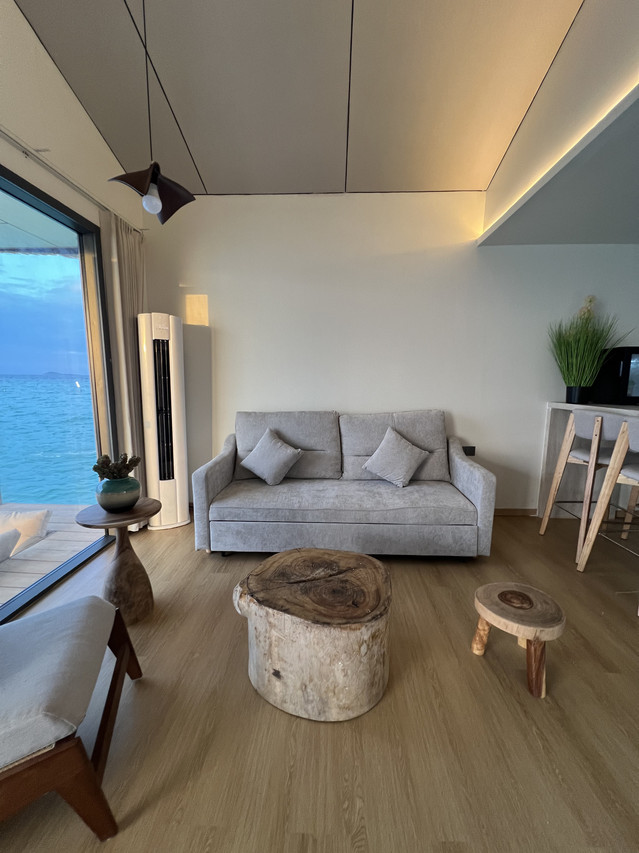 Serene bedroom at Sicily Resort where the large bed faces the sea view