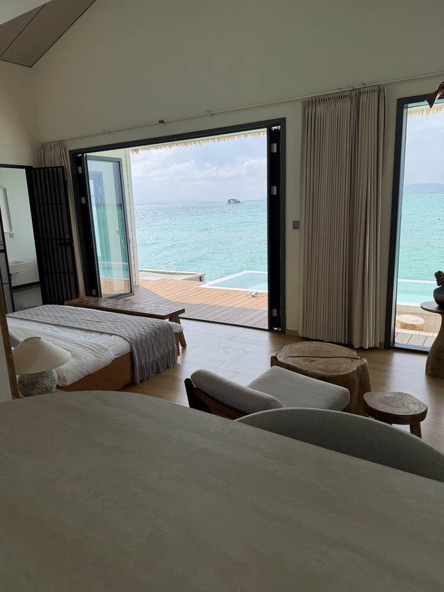 Bright family room at Sicily Hotel in the Celebes Sea featuring twin beds oceanfront