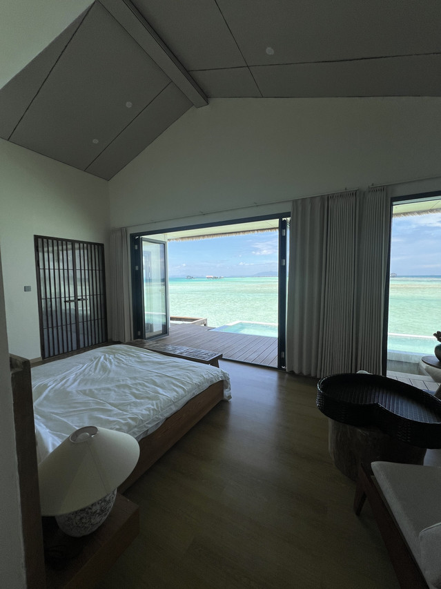 Tranquil bedroom at Sicily Hotel near Tun Sakaran Marine Park with waterfront balcony